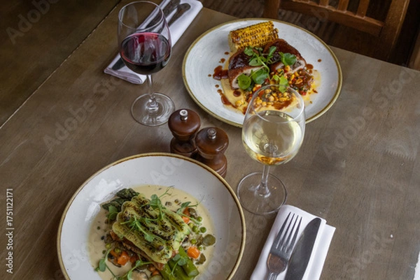 Obraz Cooked gourmet dishes - Food orders on a table in a restaurant - food styling