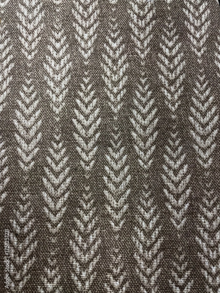 Obraz Brown woven fabric texture with light chevron pattern. Close-up of textile surface showing natural threads and geometric design, ideal background for decor, fashion, or interior projects.