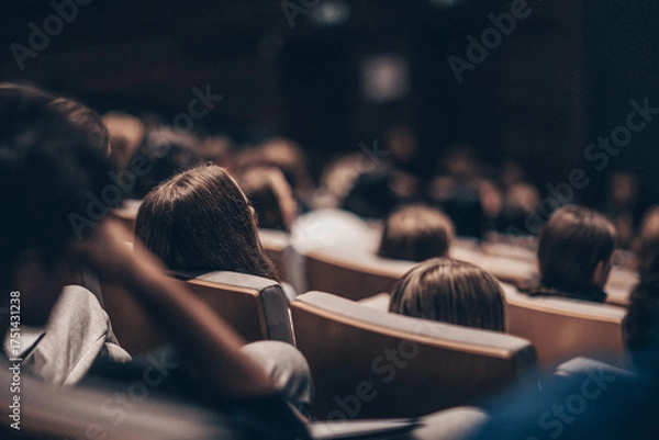 Fototapeta Rear view of unrecognizable people in audience at the conference hall. Business and entrepreneurship symposium