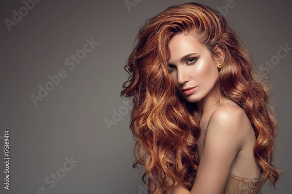 Obraz Portrait of woman with long curly beautiful ginger hair.