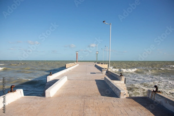 Obraz El Cuyo, Mexico; November 1, 2025: Footbridge leading to the sea in a Yucatan fishing village.