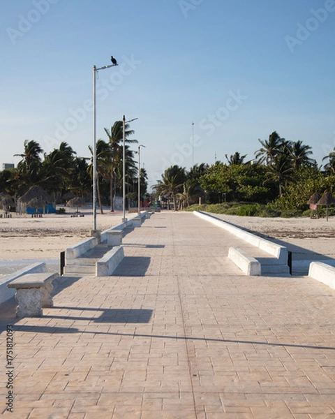 Obraz El Cuyo, Mexico; November 1, 2025: Footbridge leading to the sea in a Yucatan fishing village.