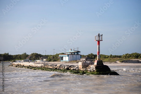 Obraz El Cuyo, Mexico; November 1, 2025: Entrance to the sea of ​​the port of a fishing village in Yucatan.