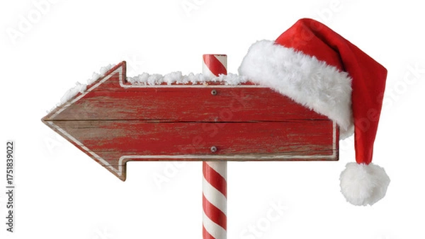 Fototapeta Rustic red wooden arrow signpost adorned with fluffy white snow and a festive santa hat pointing left isolated on transparent background