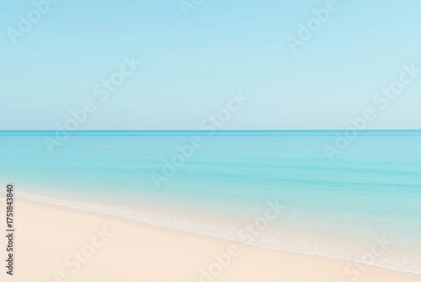 Fototapeta Serene Coastal Vista: An ethereal, minimalist view of the ocean horizon where the sky kisses the tranquil sea and the shore. It's a composition of simplicity, creating a sense of vastness and calm.