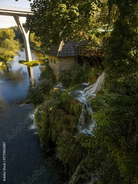 Obraz A long exposure photo of a picturesque waterfall in Rastoke, Croatia, famous for its many water cascades and mills.