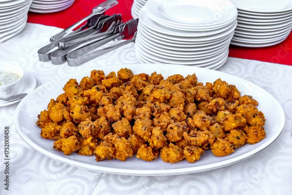Fototapeta Delicious Indian Pakora Appetizer Served on a White Platter