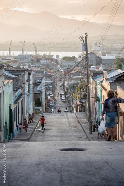 Obraz Daily life street setting at sun down in Trinidad, Cuba