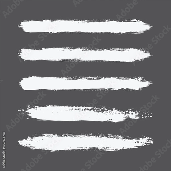 Fototapeta white grunge paint brush strokes set, distressed ink textures and abstract hand drawn brush lines, bold artistic paint stroke elements isolated on dark background. 
