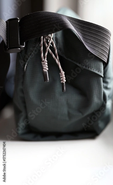 Obraz Light-colored zipper pulls on a dark blue bag