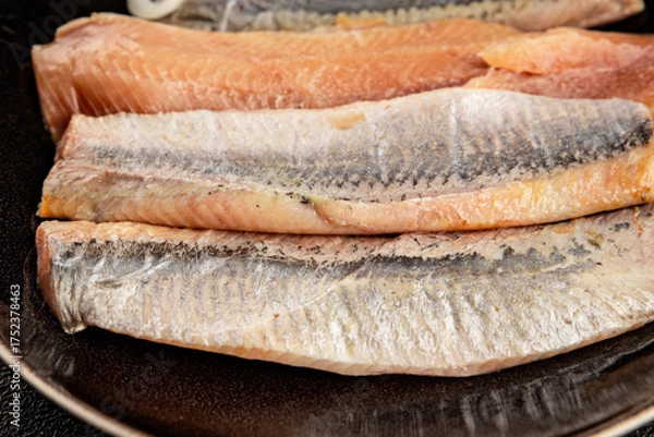 Fototapeta Herring fillet fish fresh seafood portion size natural product tasty snack fresh delicious gourmet food background on the table rustic top view copy space pescetarian diet
