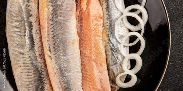 Fototapeta Herring fillet fish fresh seafood portion size natural product tasty snack fresh delicious gourmet food background on the table rustic top view copy space pescetarian diet