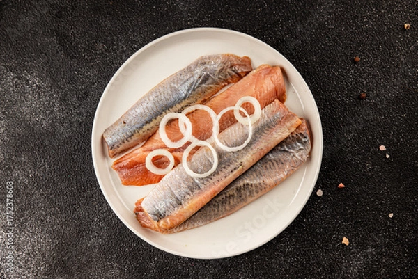 Fototapeta Herring fillet fish fresh seafood portion size natural product tasty snack fresh delicious gourmet food background on the table rustic top view copy space pescetarian diet
