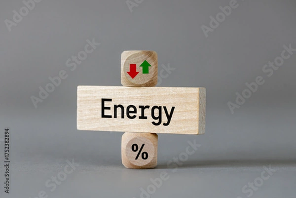Fototapeta Energy price . Wooden blocks with arrows symbolizing the increase or decrease in costs. The symbol of a percentage. Business and economic concept. close up