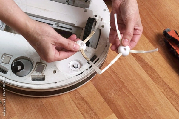 Fototapeta Do-it-yourself maintenance of robot vacuum cleaner