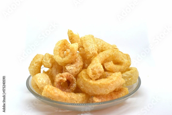 Fototapeta Pork cracklings on white background for traditional north Thai food concept.