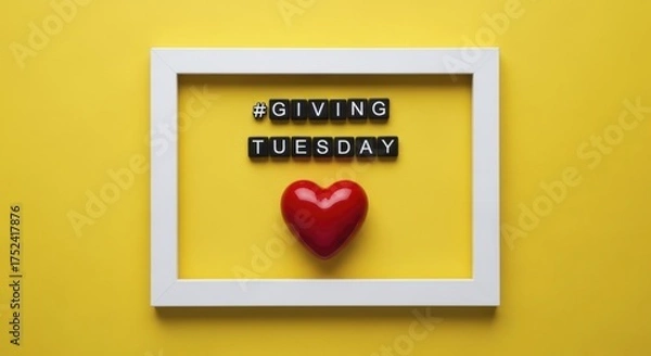 Fototapeta Giving Tuesday message with a heart in a white picture frame against yellow background