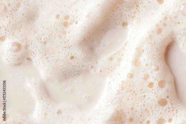 Fototapeta Abstract top-down liquid texture with foam pattern. Foamy liquid surface with bubbles for beverage, cosmetic, or soap concept. Macro background.