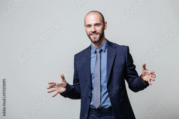 Fototapeta Successful businessman. Portrait of confident young man in formalwear looking at camera