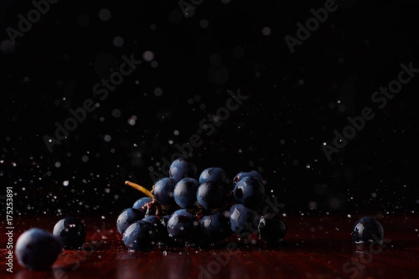 Fototapeta Bunch of fresh red grapes splash fruit, grocery, harvest, health, ingredient, bluegrapes, darkgrapes, drink, fall, grapecluster, nature