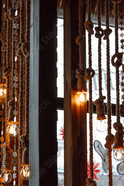 Fototapeta beautifully arranged display featuring golden ornaments and decorative plants creates vibrant atmosphere, enhancing festive spirit in cozy indoor space. vertical. close up.