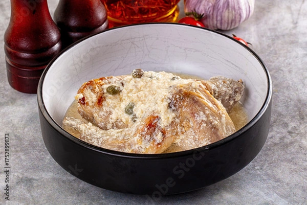 Fototapeta Roasted rabbit legs in cream sauce