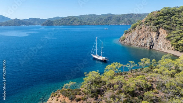 Fototapeta Beautiful aerial view of a classic Turkish gulet sailing in the calm Aegean Sea.