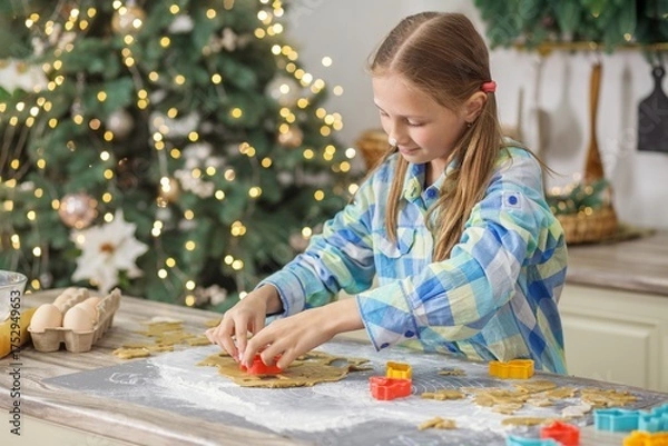 Obraz Child using cookie cutter on holiday dough