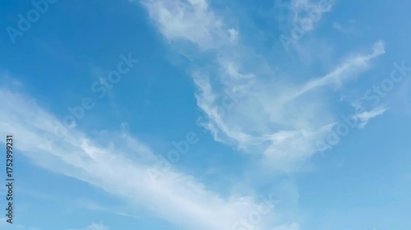 Obraz Bright Blue Sky with Wispy Clouds Drifting Across the Horizon