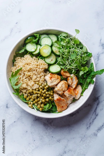 Fototapeta Balanced quinoa, arugula, chicken, cucumber and pea lunch bowl.