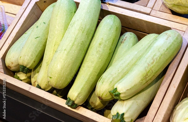 Obraz The zucchini is light green in color neatly stacked in a wooden box