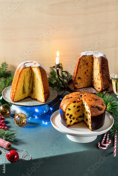 Obraz Different types of sweet Italian panettone cakes on a festive Christmas table