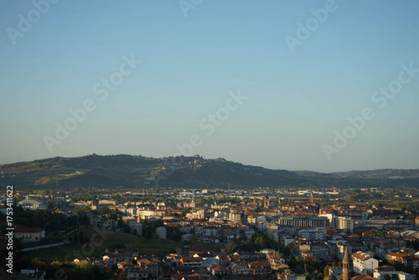 Fototapeta Cityscape of Alba and Langhe hills