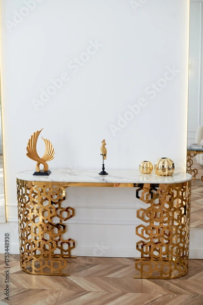 Obraz A table with a metallic gold underframe. Luxurious minimalist interior. White and gold palette,