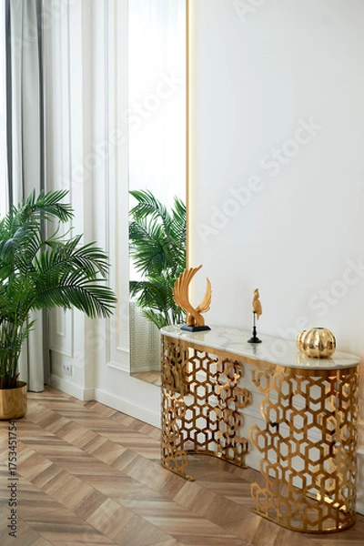 Obraz A golden chandelier with many light bulbs. Style, minimalism and luxury,