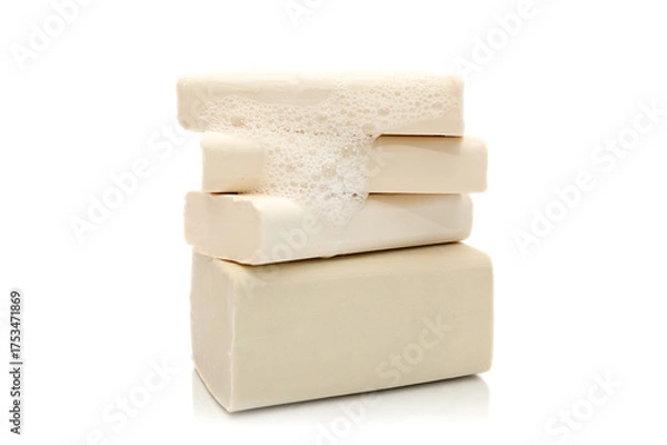 Fototapeta White natural handmade soap with foam on white background.