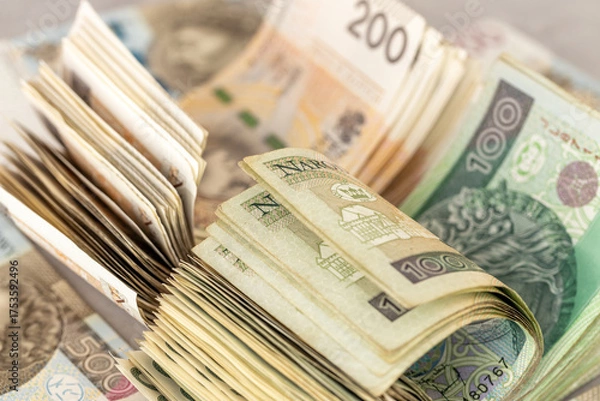 Obraz Poland money. A large stack of 100 and 200 zloty bills. Polish finances. Business background, economic concept. Polish savings, analysis of expenses, investments, housing loans, stock market.