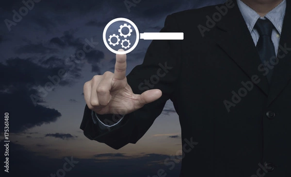 Fototapeta Businessman pressing seo flat icon over sunset sky, Search engine optimization concept