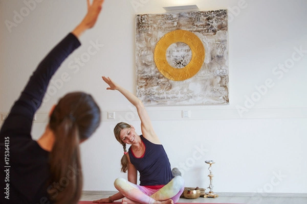 Fototapeta Yoga instructor teaching class