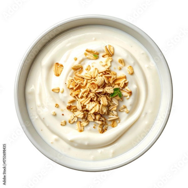 Obraz Overhead view of a white ceramic bowl filled with creamy yogurt and sprinkled granola