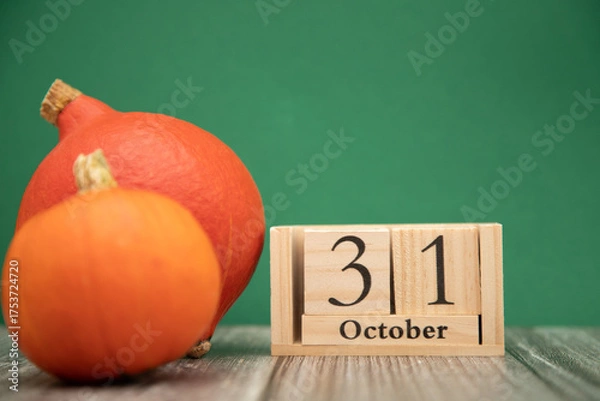 Obraz Orange pumpkins on a green background. Halloween October 31