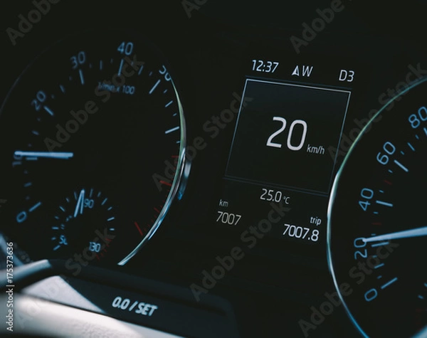 Fototapeta Car speedometer close-up with the needle pointing a 20 km/mph speed driving electric car digital display screen 