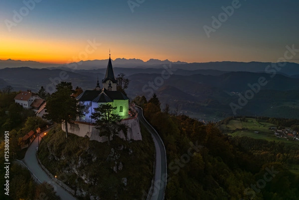 Fototapeta Evening view of the Church of the Birth of Mary atop Zasavska Sveta Gora, a historic pilgrimage site with Gothic and Baroque architecture.