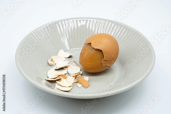 Obraz Boiled eggs in a circular bowl on a white background