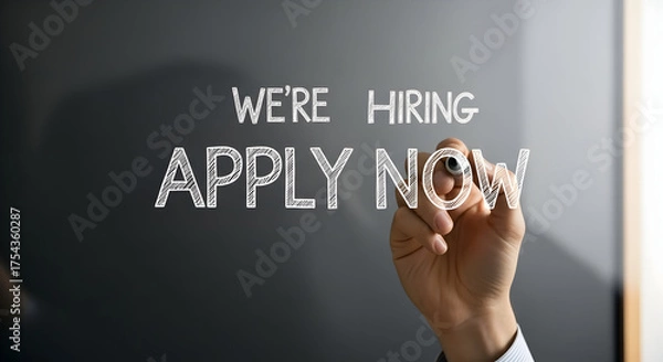 Fototapeta We're Hiring: Hand Writes Apply Now on Glass Wall for Job Opportunities