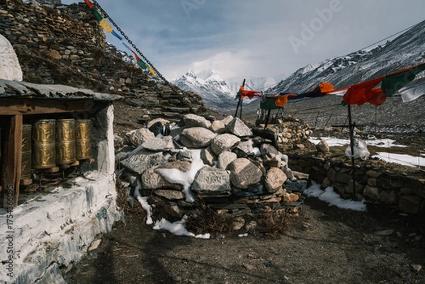 Fototapeta Rongbuk Monastery, the highest monastery in the world, near Mount Everest in Tibet. Ancient Buddhist site with prayer flags and snowy Himalayan peaks in the background
