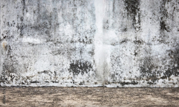 Fototapeta Grunge concrete wall and floor with aged stains and rough textures. Perfect for urban background, vintage design, product mockup, industrial themes, or grungy presentation templates.