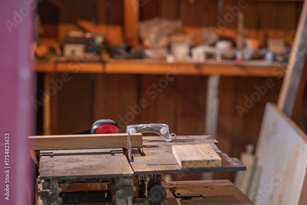 Obraz A sawmill with protective equipment lying on it.