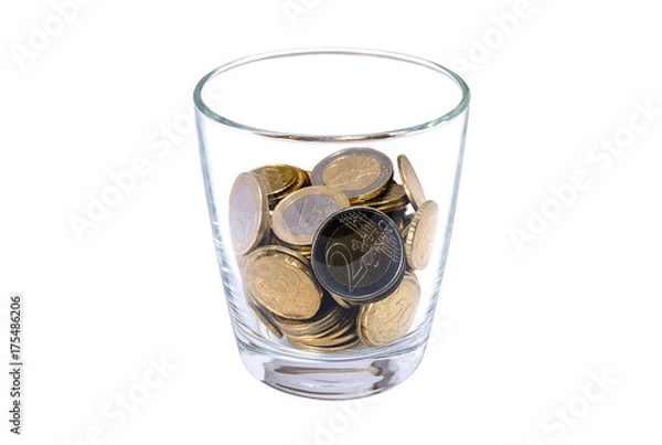 Obraz Glass with coins on white background: concept of financial savings