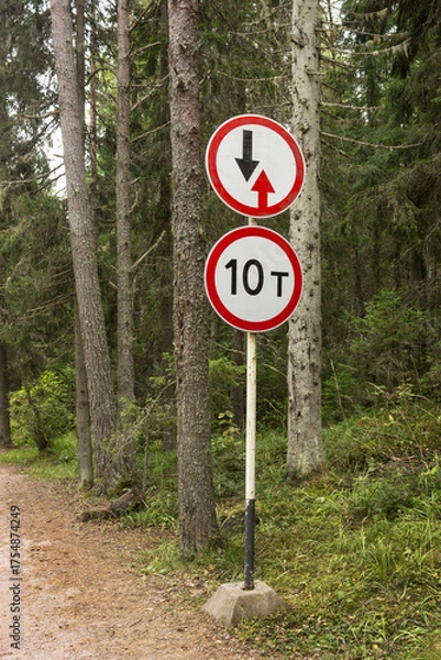 Obraz There is a "weight limit" sign on the forest road before entering the bridge